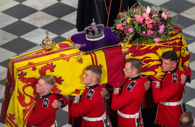 The British Imperial State Crown, Sceptre and Orb were laid on the coffin of Queen Elizabeth along with a large and colourful wreath from King Charles III. Photo: Reuters